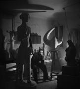 Anton Prinner, dans son atelier au milieu de ses sculptures avec "Femme-taureau" (1937) à droite, rue Pernety, Paris, 1946